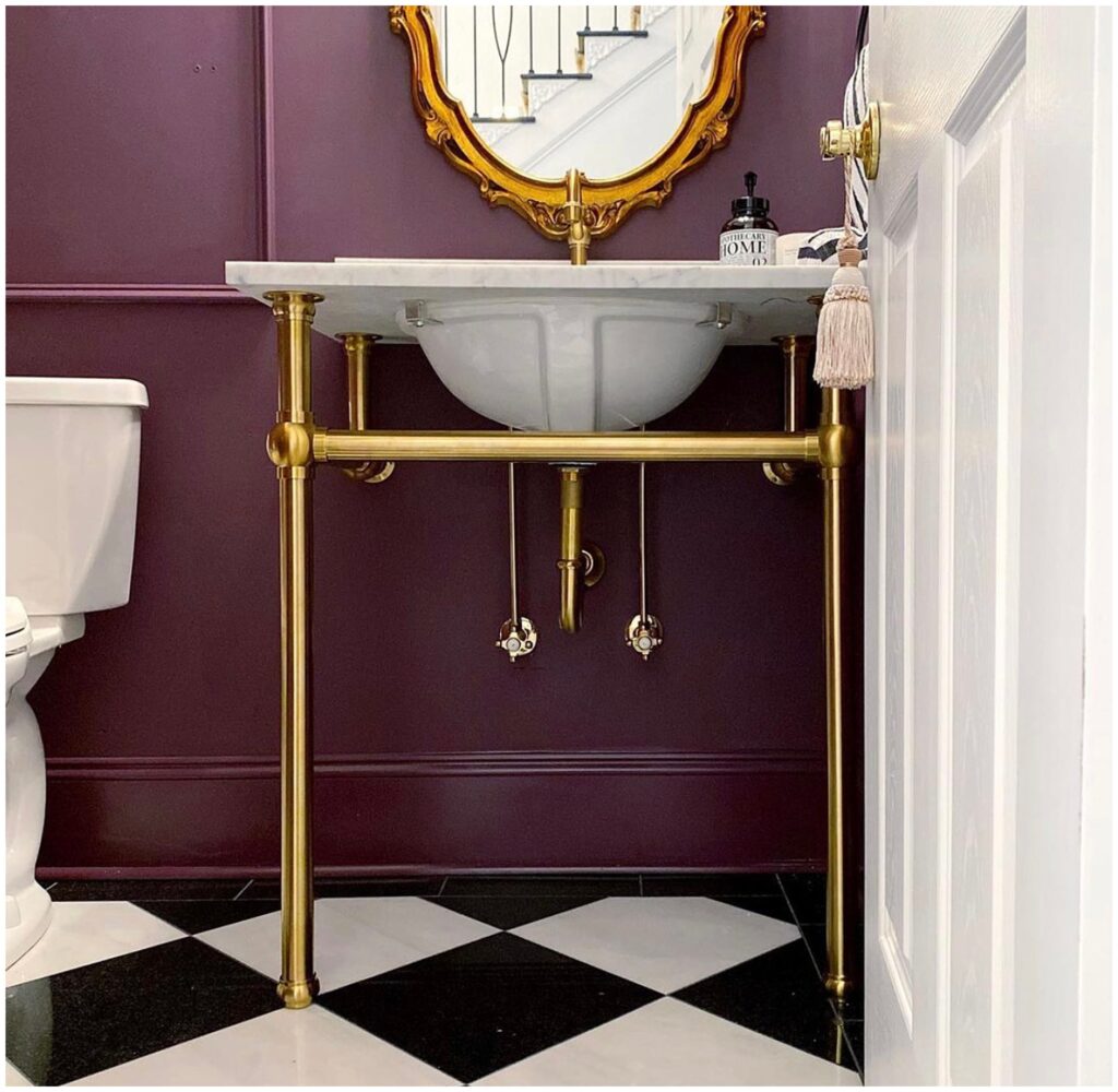 vintage freestanding bathroom vanity in moody black and white space