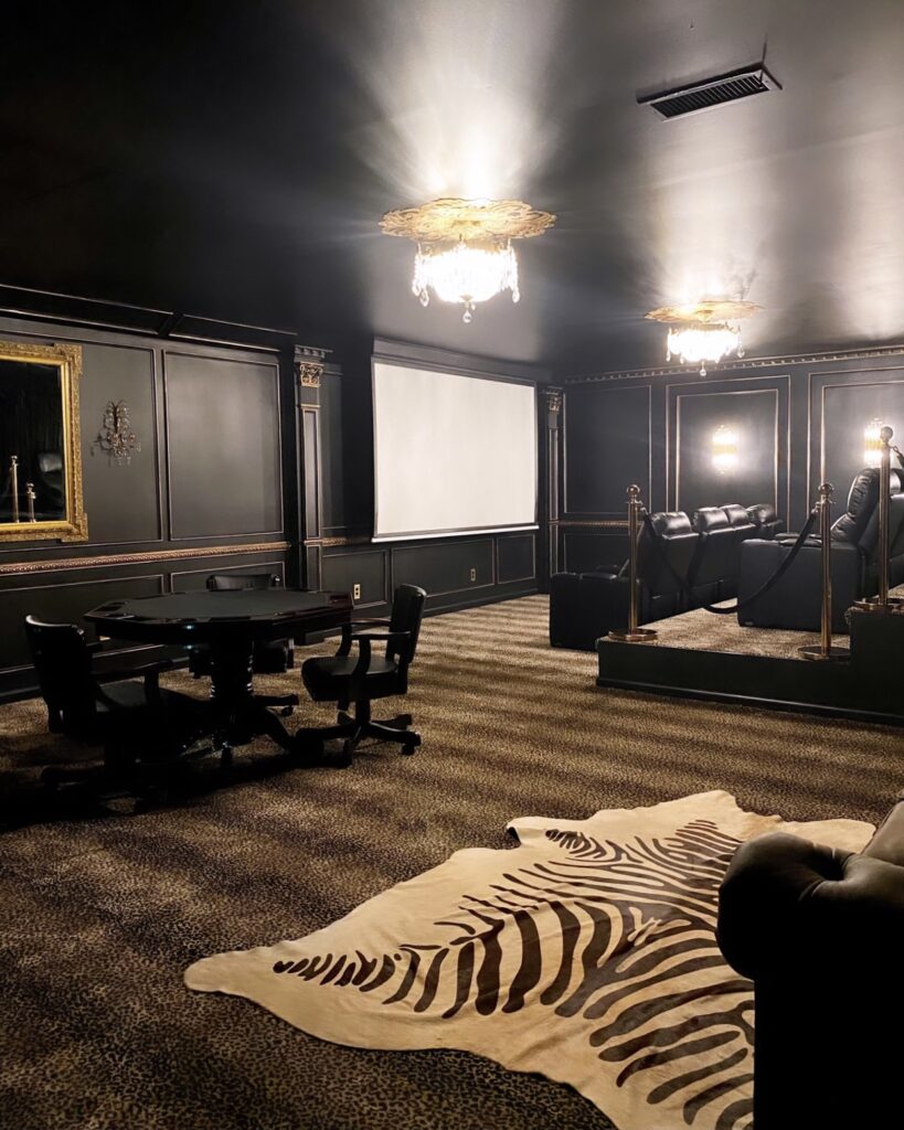 Mixing Animal Prints With Zebra Throw Rug And Cheetah Carpeting In Media Room