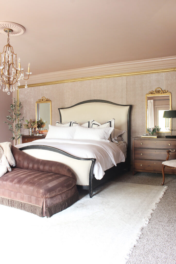 Neutral Primary Bedroom With White Rugs On Carpet