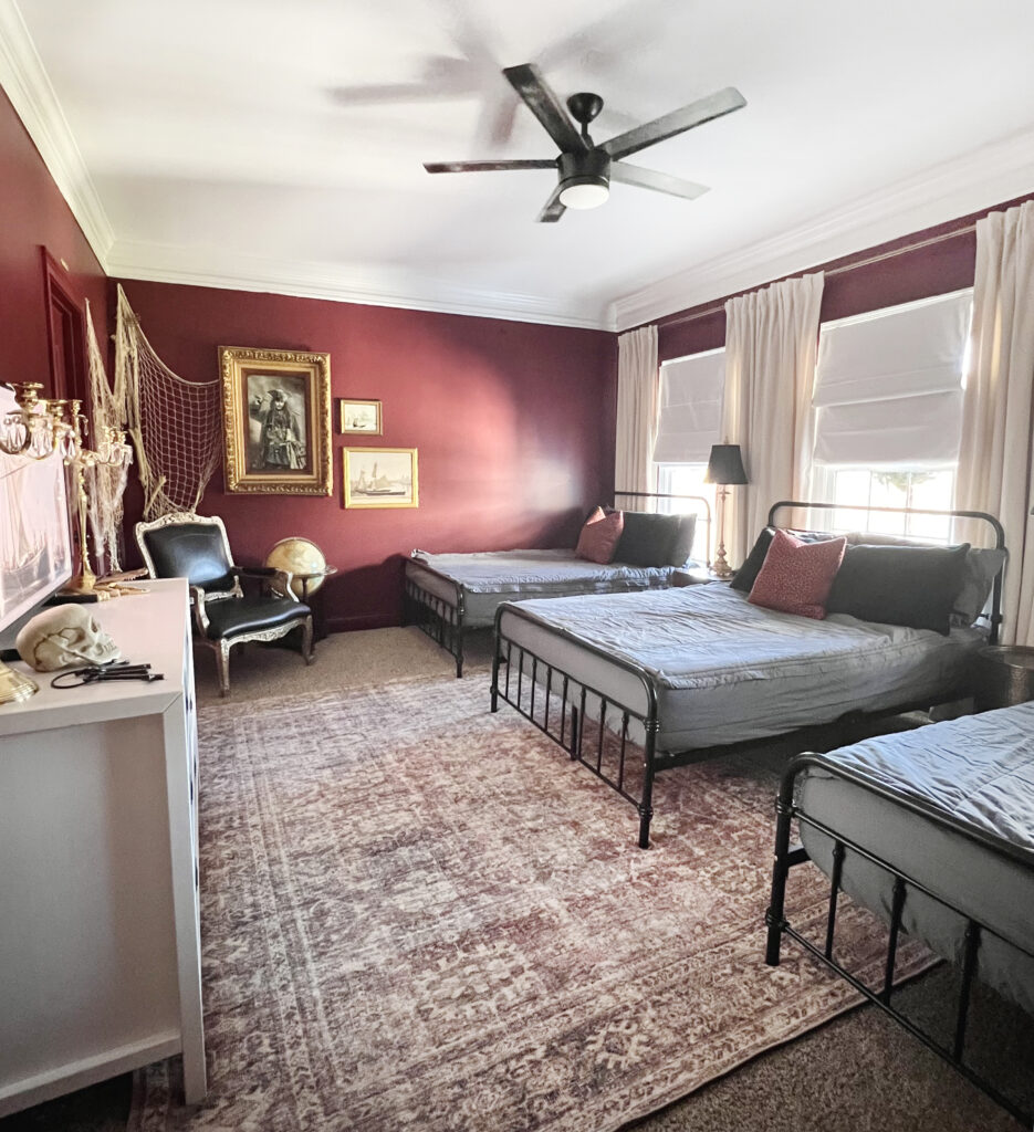 Oversized Red Patterned Rug In Pirates Themed Boy's Bedroom