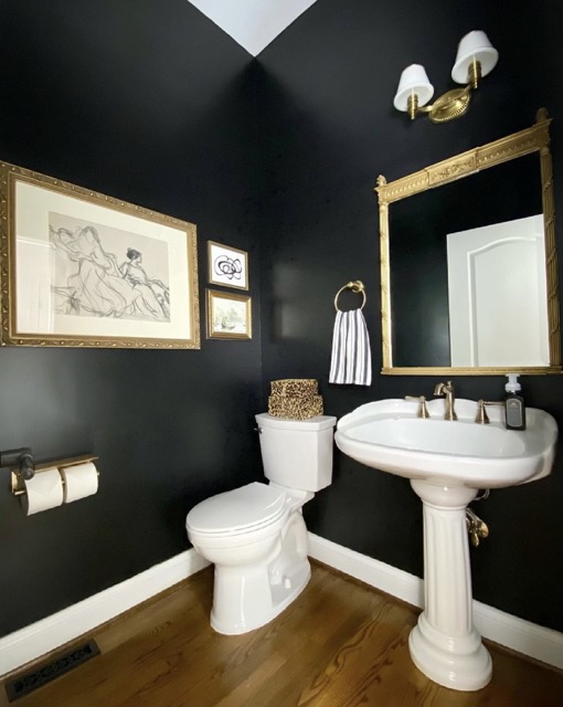 All-Black Room Emphasizing Art In Powdered Bathroom