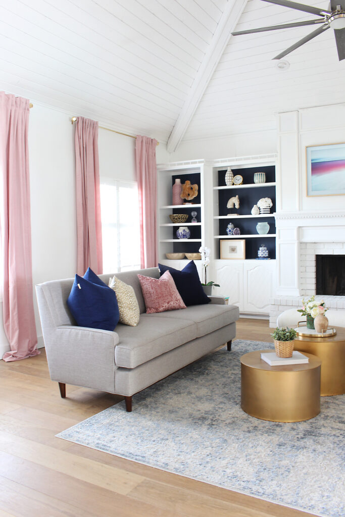 Living Room Built-In Cabinets With Navy Blue Painted Back